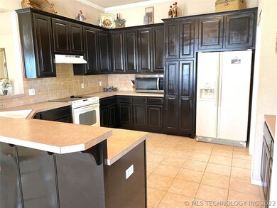 Abundance of storage space in kitchen that flows p