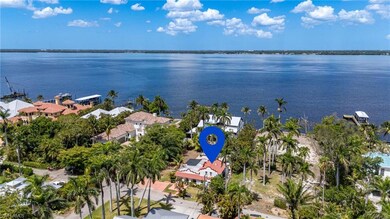 Aerial view of residential area featuring a large body of water