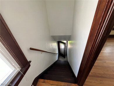 Stairway leading from second floor unit to front porch