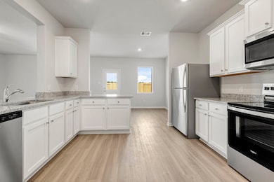 Whirlpool kitchen appliances and granite counterto