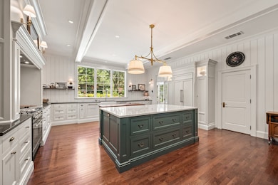 A spectacular kitchen with a large, over-the-sink window with backyard views.