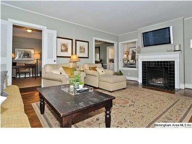 Large living room with a wood burning fireplace