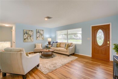 View of living room and hallway to guest bedrooms and bathroom.