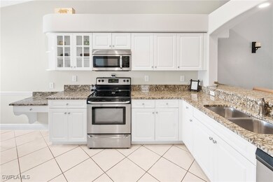 Kitchen featuring stainless steel appliances, ligh