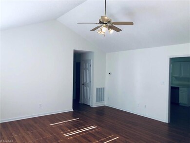 Family room looking into the master bedroom wing and to the right the kitchen and dining room