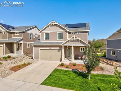 Craftsman house with a garage, a front yard, cover