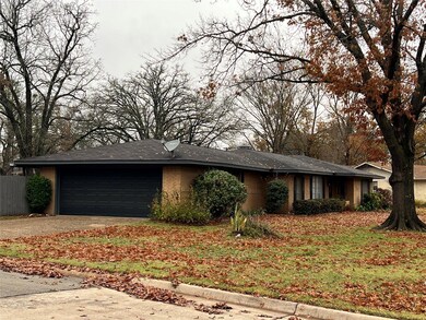 Ranch-style house featuring a garage