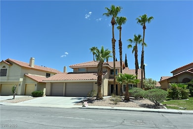 Mediterranean / spanish home featuring an attached