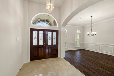 View of foyer and formal dining areas from the liv
