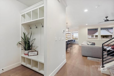 Mudroom with light wood-type flooring, ceiling fan, and recessed lighting