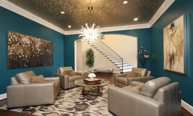 Formal dining room is currently being used as a formal living/lounge.  Bespoke paint and ceiling treatment