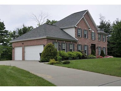 Exterior Front. Side view with Garage