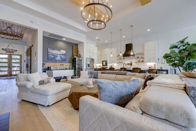 Living room featuring an inviting chandelier, a r