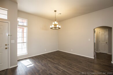 Large Dining Room features updated chandelier, bea