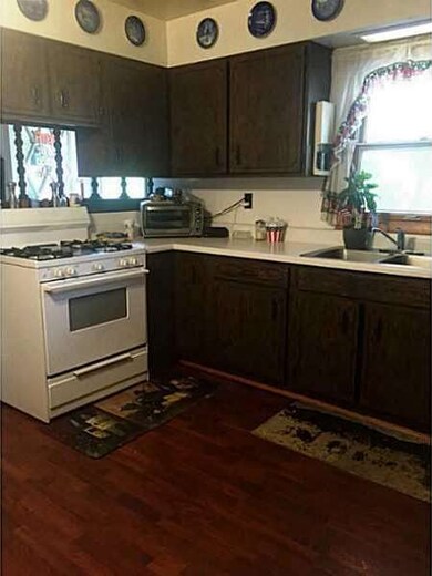 Kitchen. Gas stove, nice laminate floors, ample ca