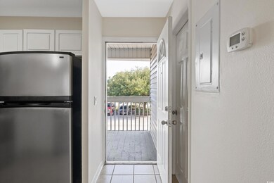 Doorway to outside featuring light tile patterned 