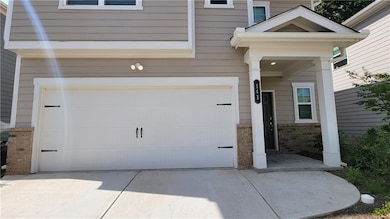 Garage with concrete driveway