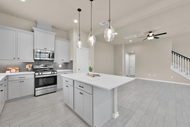 Expansive island offers extra seating and prep spa