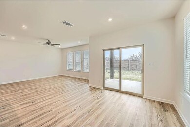 Empty room with light wood finished floors, baseb