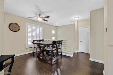Dining room featuring ceiling fan, baseboards, and