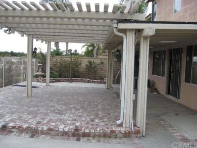 Brick, lattice covered patio