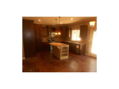 Open kitchn area includes granite and SS appliance