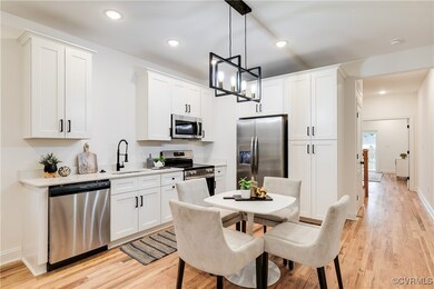 Kitchen featuring stainless steel appliances, whit