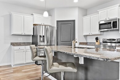 Kitchen with a kitchen breakfast bar, white cabine