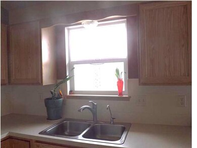 Kitchen Window Over Looking Backyard.