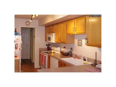 Lots of oak cabinets in the eat-in kitchen.