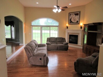 SUNKEN LIVING ROOM W/FIREPLACE