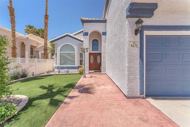 Entrance to property featuring stucco siding, a ti