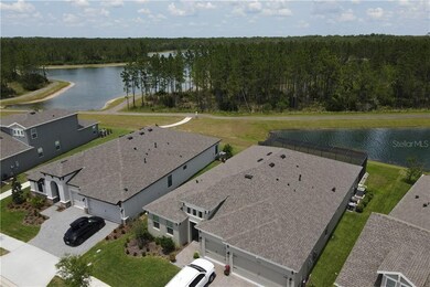Drone view of lakes (subject home with white SUV)