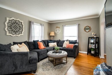 Spacious living room featuring cove ceiling, gorge