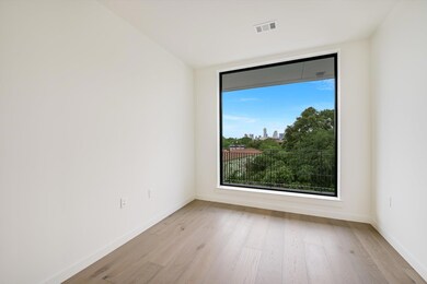 Unfurnished room with light wood-type flooring, v