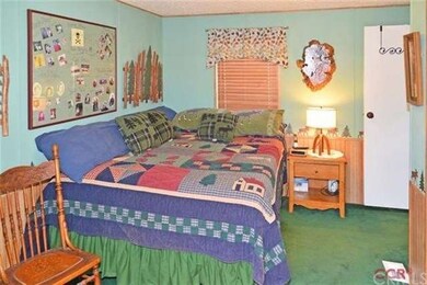 Master bedroom has slider to patio area.