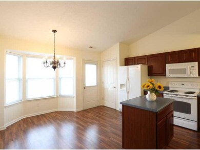 Breakfast Area/Room. The breakfast room bright and open with lots of natural light streaming in through the bay window.