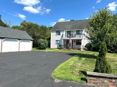 Exceptional feature is the 2 car garage shown on left, its proximity to the unit and all the extra parking space on the blacktop