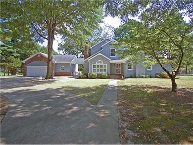 It has a 2 car garage, a beautiful walkway to the 