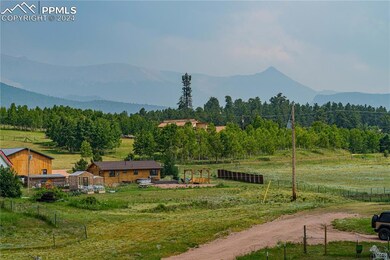 Property view of mountains with a rural view