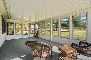 SUNROOM OFF FRONT PORCH