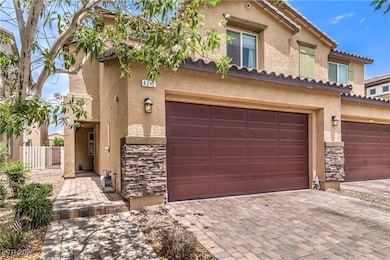 View of front of house with stone siding, stucco s
