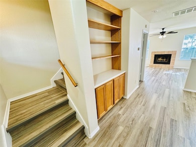 Hallway featuring light wood finished floors and 
