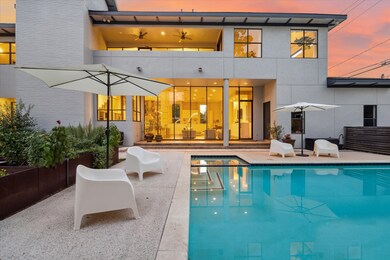 Looking into family room across pool . Upstairs la
