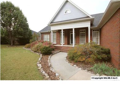 WELCOMING APPROACH FEATURES COLORFUL LANDSCAPING