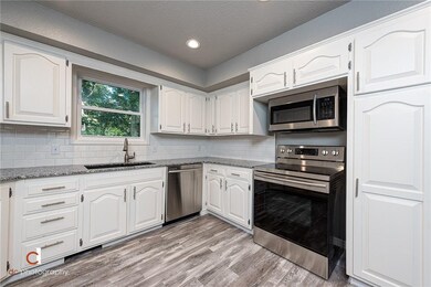 Tons of cabinets and brand new appliances await you in this beautiful, open kitchen.