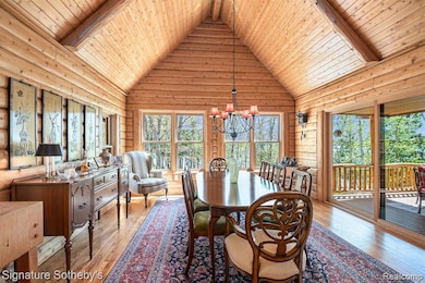 Dining Room w/wall of windows and larger doorwall