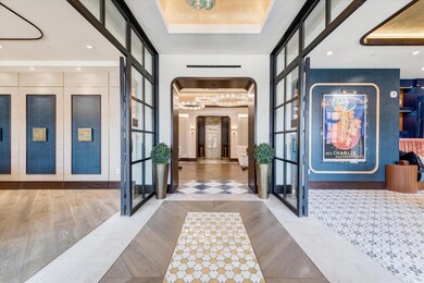 Foyer entrance with french doors, a tray ceiling, 