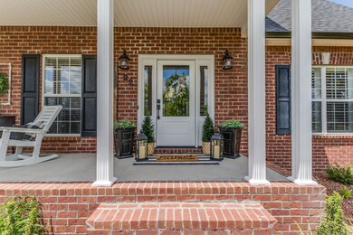 The front entrance offers a beautiful setting for arriving guests.