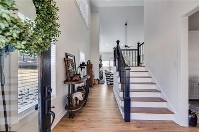 Stairway featuring hardwood / wood-style flooring 